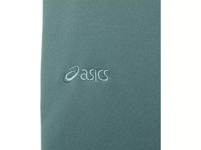 Sivulla nappikiinnityksellä varustetut neulehousut