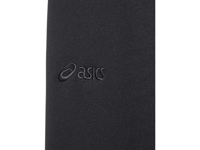 Sivulla nappikiinnityksellä varustetut neulehousut